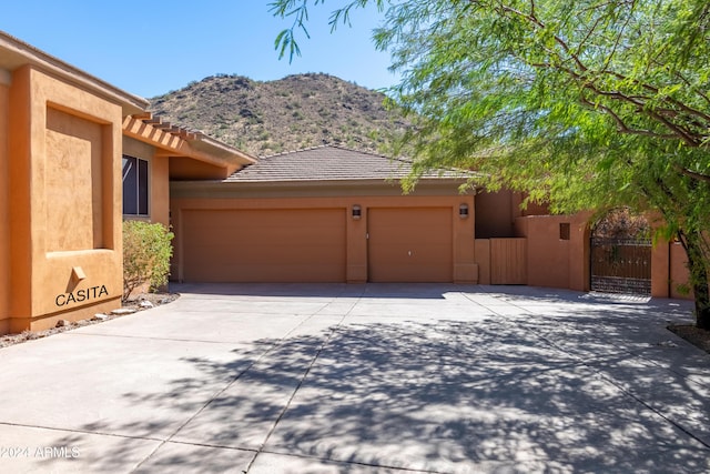 15972 N 115th Way, Scottsdale, AZ 85255 - garage featuring concrete driveway and a mountain view