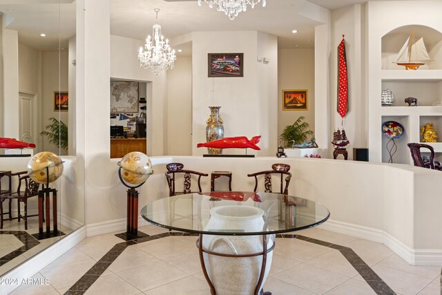15972 N 115th Way, Scottsdale, AZ 85255 - dining space featuring inlaid floor details, built in features, a chandelier, recessed lighting, and baseboards