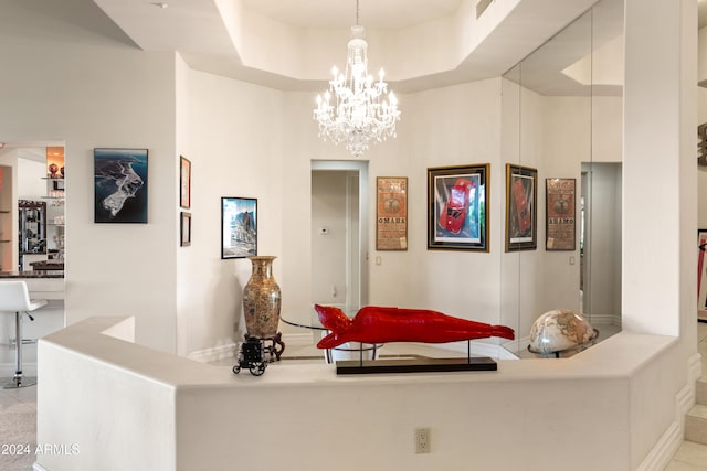 15972 N 115th Way, Scottsdale, AZ 85255 - hallway with a chandelier, baseboards, and a tray ceiling
