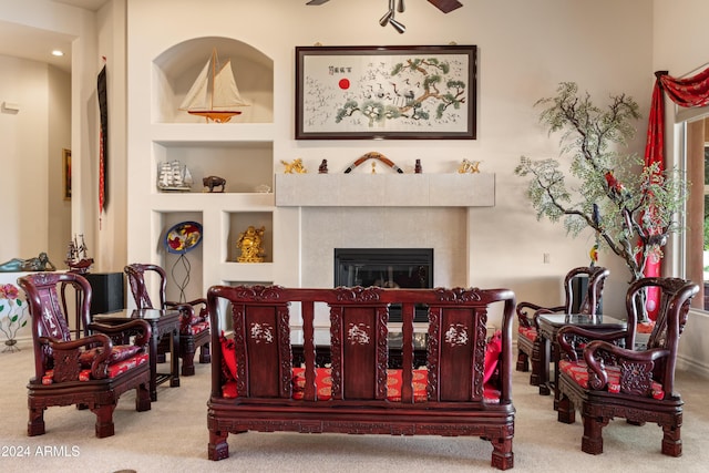 15972 N 115th Way, Scottsdale, AZ 85255 - sitting room with carpet flooring, built in features, a glass covered fireplace, and recessed lighting