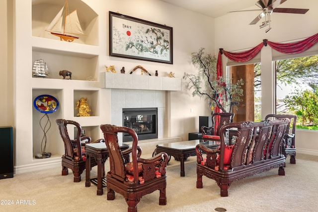 15972 N 115th Way, Scottsdale, AZ 85255 - sitting room with carpet floors, healthy amount of natural light, a ceiling fan, and a tile fireplace