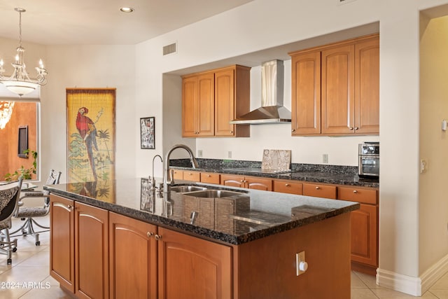 15972 N 115th Way, Scottsdale, AZ 85255 - kitchen with wall chimney exhaust hood, light tile patterned floors, an island with sink, a sink, and dark stone countertops