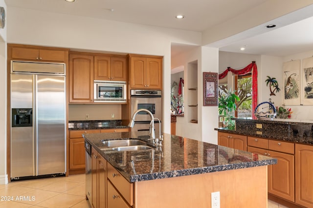 15972 N 115th Way, Scottsdale, AZ 85255 - kitchen featuring built in appliances, a sink, an island with sink, recessed lighting, and dark stone counters