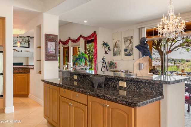 15972 N 115th Way, Scottsdale, AZ 85255 - bar with a chandelier, light tile patterned floors, decorative light fixtures, baseboards, and oven