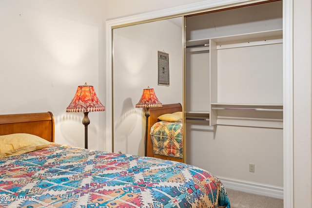 15972 N 115th Way, Scottsdale, AZ 85255 - bedroom with carpet, a closet, and baseboards