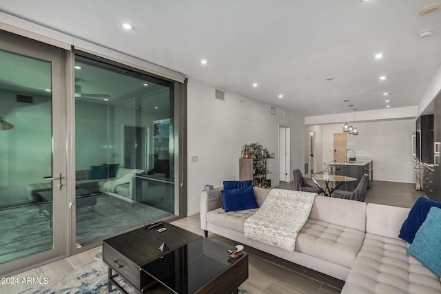 living room featuring recessed lighting, visible vents, and wood tiled floor