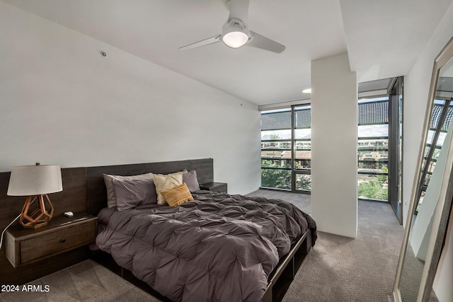 bedroom featuring a ceiling fan, carpet, and floor to ceiling windows