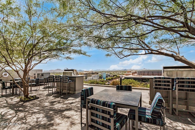 view of patio with exterior kitchen and outdoor dining space