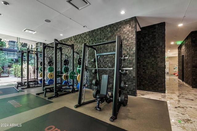 workout area featuring expansive windows and visible vents