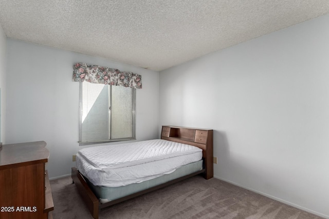 carpeted bedroom featuring a textured ceiling