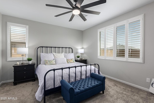 bedroom featuring ceiling fan and carpet