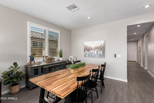 dining area featuring dark hardwood / wood-style flooring