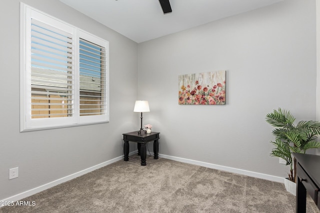 unfurnished room featuring ceiling fan and light colored carpet