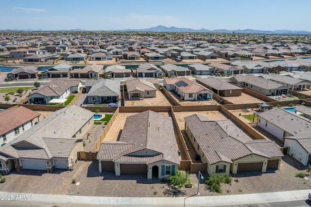 birds eye view of property with a mountain view