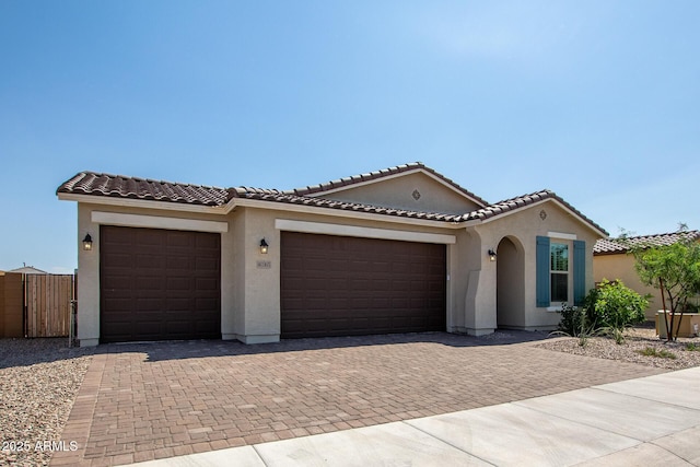 mediterranean / spanish-style home featuring a garage