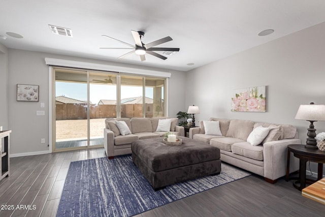 living room with ceiling fan and dark hardwood / wood-style floors