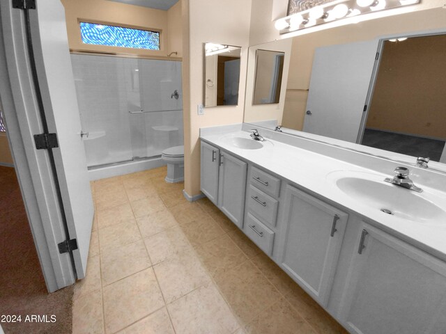 bathroom with a shower with shower door, toilet, tile patterned flooring, and dual bowl vanity