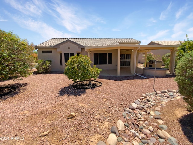 rear view of house featuring a patio area