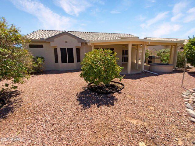 rear view of house featuring a patio area