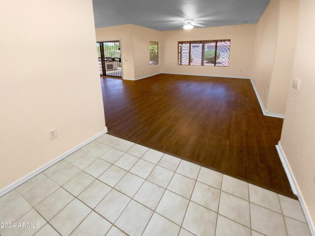 spare room featuring ceiling fan and light wood-type flooring