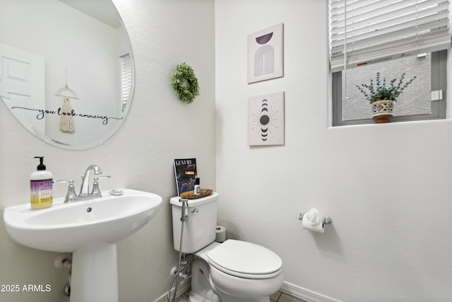 bathroom with sink and toilet