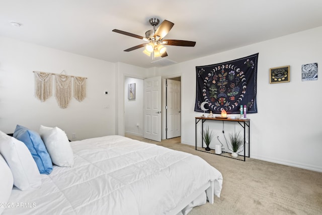 bedroom featuring ceiling fan and light colored carpet