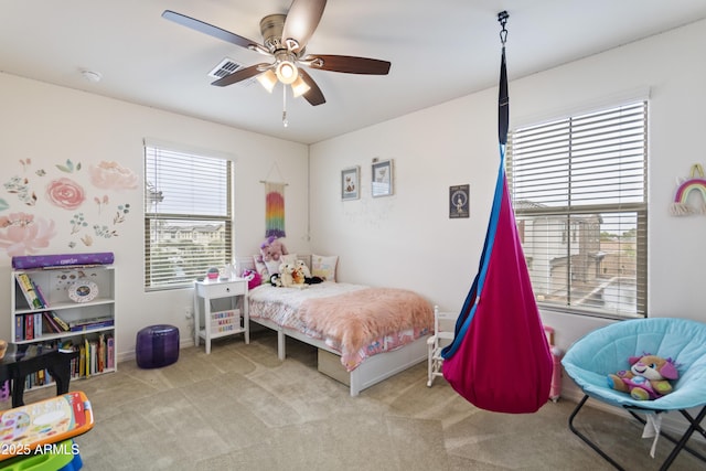 bedroom featuring ceiling fan and light carpet