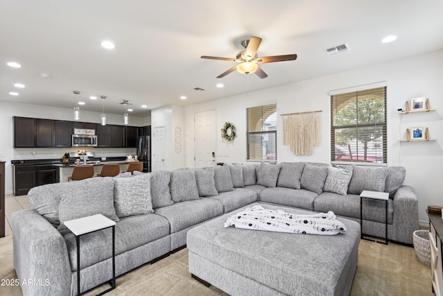 living room featuring ceiling fan