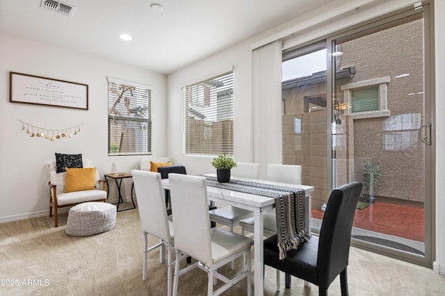 view of carpeted dining space