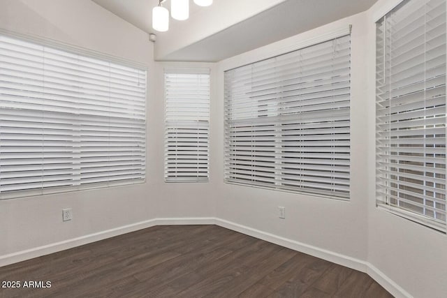 unfurnished room featuring dark hardwood / wood-style flooring