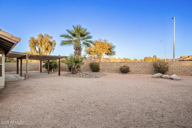 view of yard featuring a pergola and a patio area