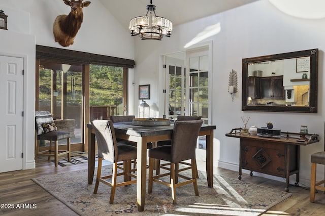 4562 N Dream Catcher Way, Pine, AZ 85544 - dining space with a chandelier, high vaulted ceiling, and wood finished floors