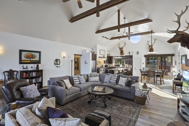4562 N Dream Catcher Way, Pine, AZ 85544 - living area featuring a ceiling fan, high vaulted ceiling, light wood finished floors, and beam ceiling