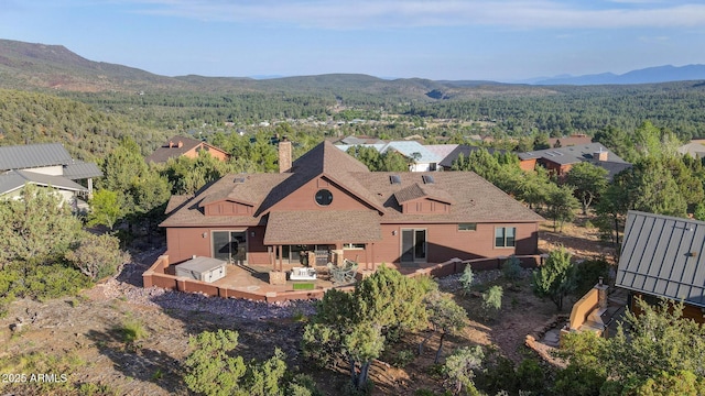 4562 N Dream Catcher Way, Pine, AZ 85544 - aerial view of property and surrounding area featuring a heavily wooded area and a mountain backdrop