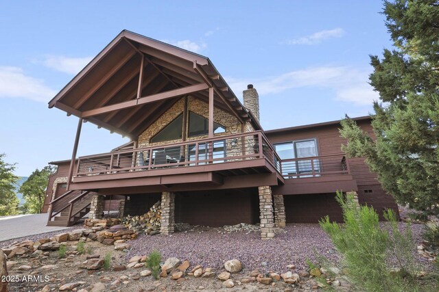 4562 N Dream Catcher Way, Pine, AZ 85544 - back of property featuring stone siding, a wooden deck, stairs, and a chimney