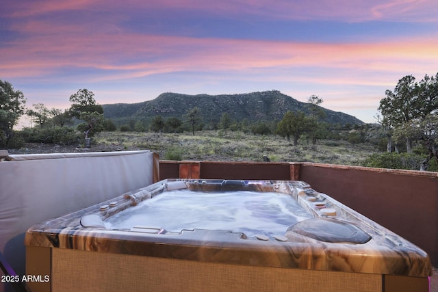4562 N Dream Catcher Way, Pine, AZ 85544 - patio terrace at dusk featuring a hot tub and a mountain view