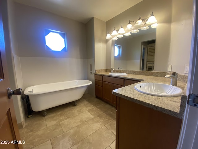 19322 E Calle De Flores, Queen Creek, AZ 85142 - bathroom with tile patterned floors, double vanity, a freestanding bath, and a sink