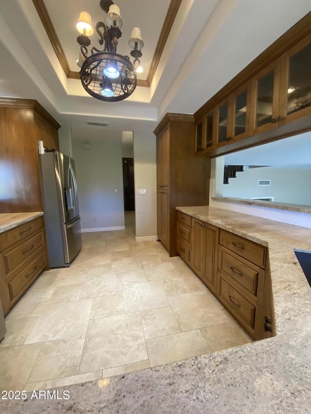 19322 E Calle De Flores, Queen Creek, AZ 85142 - kitchen featuring stainless steel fridge with ice dispenser, crown molding, light stone countertops, and a raised ceiling