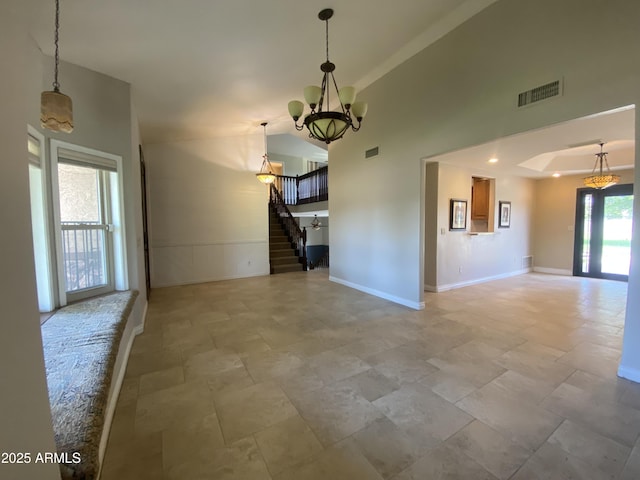 19322 E Calle De Flores, Queen Creek, AZ 85142 - interior space with baseboards, visible vents, stairs, a chandelier, and vaulted ceiling