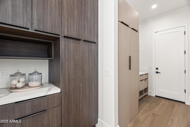 interior space with light wood-type flooring and recessed lighting