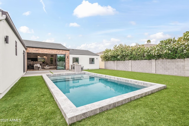 view of pool featuring a fenced in pool, a lawn, and a fenced backyard