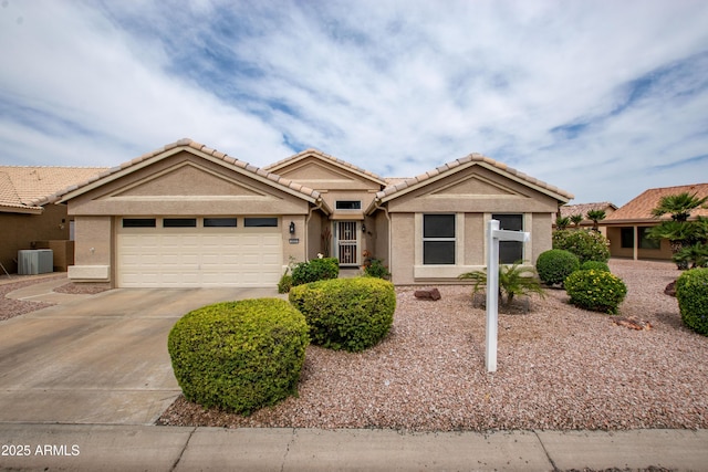 3022 N 148th Ave, Goodyear, AZ 85395 - ranch-style home with a tiled roof, a garage, driveway, stucco siding, and central air condition unit