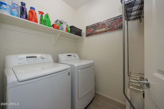 washroom featuring washing machine and clothes dryer