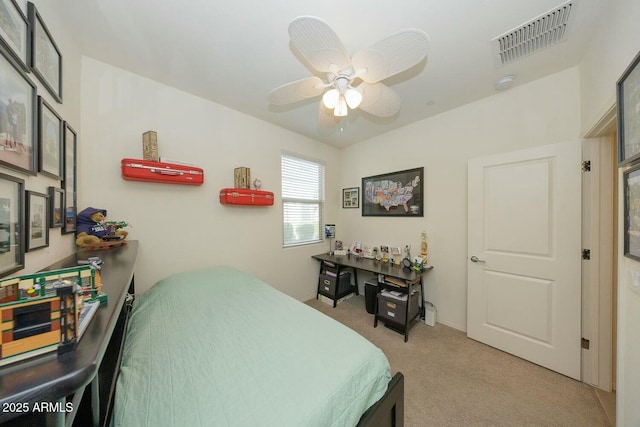 bedroom featuring light carpet and ceiling fan