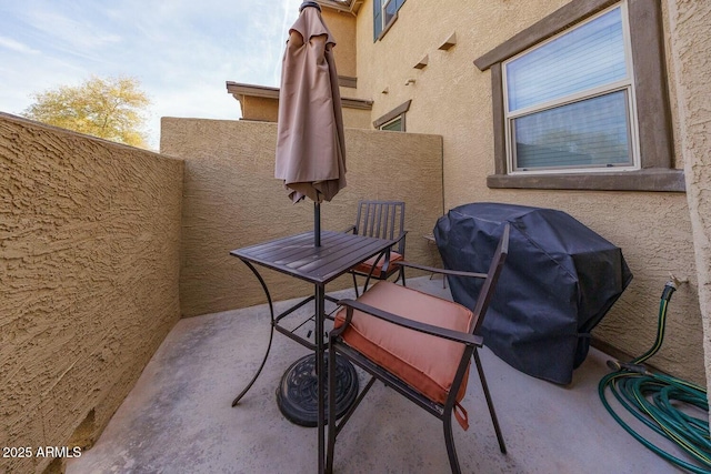 view of patio featuring a balcony and area for grilling