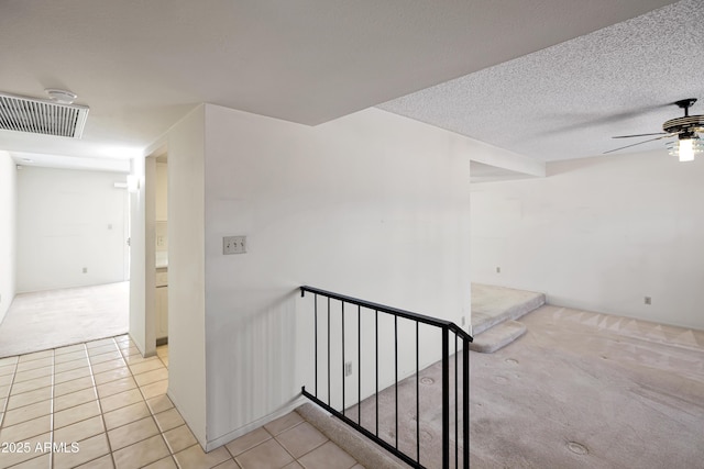 8326 E Valley View Rd, Scottsdale, AZ 85250 - corridor featuring an upstairs landing, light colored carpet, light tile patterned flooring, and a textured ceiling
