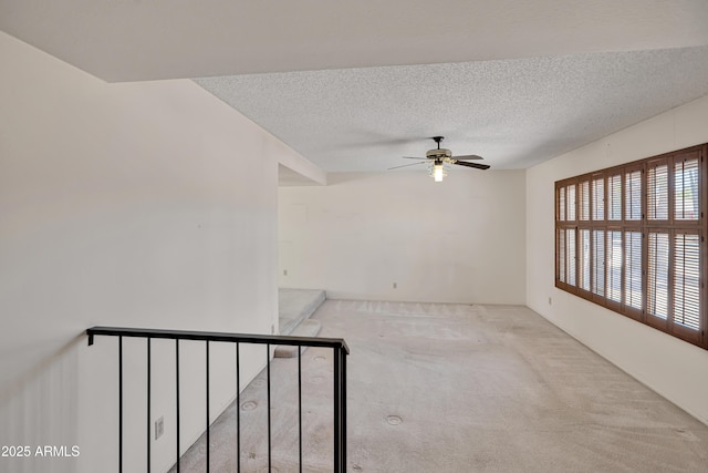 8326 E Valley View Rd, Scottsdale, AZ 85250 - empty room featuring carpet flooring, a ceiling fan, and a textured ceiling