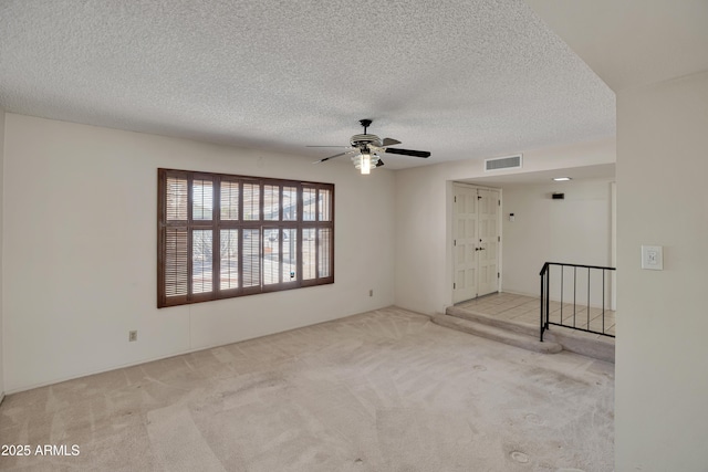 8326 E Valley View Rd, Scottsdale, AZ 85250 - spare room with carpet flooring, a ceiling fan, and a textured ceiling