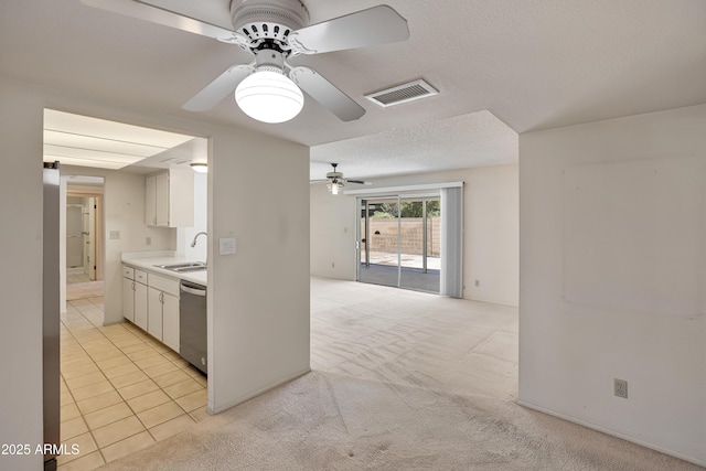 8326 E Valley View Rd, Scottsdale, AZ 85250 - kitchen with stainless steel dishwasher, a ceiling fan, a sink, white cabinets, and light countertops