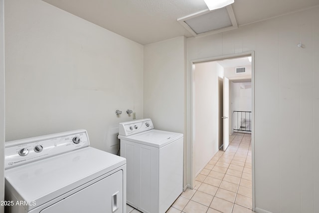 8326 E Valley View Rd, Scottsdale, AZ 85250 - laundry area featuring independent washer and dryer and light tile patterned flooring